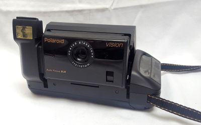 a polaroid camera sitting on a white surface