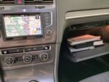 a car dashboard with a gps device in the center of it