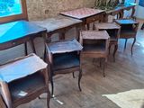 tables and chairs in a room with a cow skin rug on the floor
