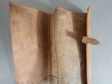 a leather case with a magnifying glass inside of it