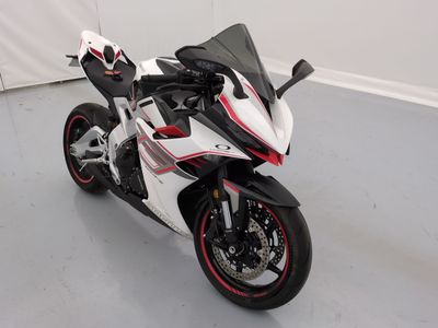a picture of a white and red motorcycle parked in a garage