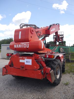 a red crane that is parked on the side of the road