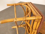 a wicker chair that is sitting on a table