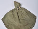 a small bag with a wooden handle on a white surface