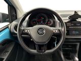 the interior of a car with a steering wheel and dashboard controls