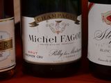 three bottles of wine sitting on a table next to each other