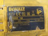 the back end of a yellow machine with a sign on it