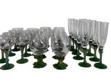 a lot of wine glasses that are sitting on a table