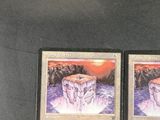 two cards that are sitting on a table