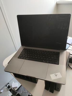 a laptop computer sitting on top of a desk