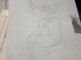 a drawing of a boy sitting on a pile of papers