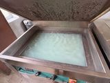 a large metal box with a glass inside of it