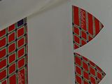 three envelopes with different designs on them sitting next to each other