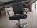 a person that is sitting on a chair in a room