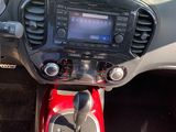 a car dashboard with a radio and a steering wheel