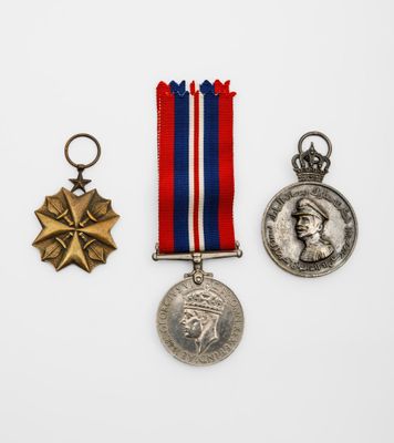 three medals and a medal on a white background