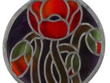 a picture of a stained glass rose in a circle