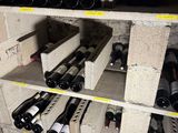 many bottles of wine on the shelves in the wine cellar