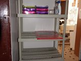 a shelf with a lot of items on it in a room