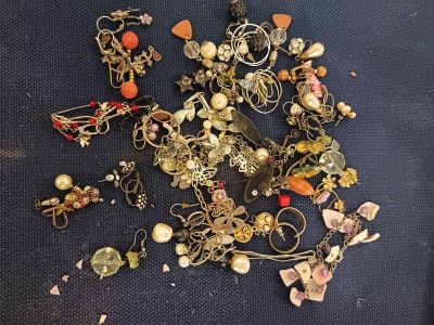 a pile of jewelry that is on a table