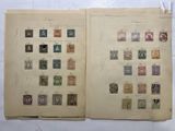 an open book with a lot of different stamps on it