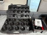 a black case with a bunch of cups inside of it