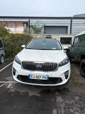 a white car that is parked in a parking lot
