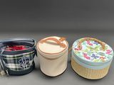 three buckets that are next to each other on a table
