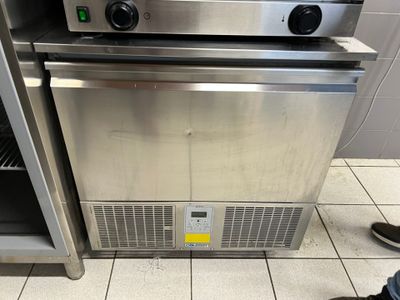 two ovens that are sitting in a kitchen