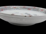 a white bowl with a floral design on it