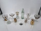 a lot of glasses and a bottle on the table