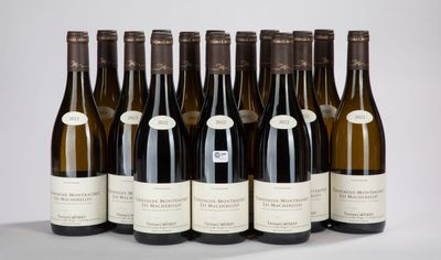 six bottles of wine are lined up in a row on a table