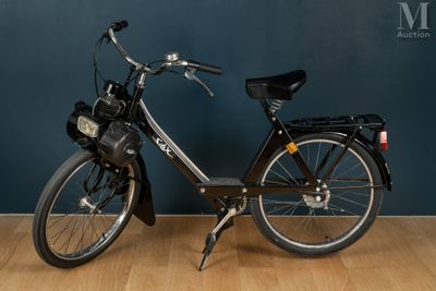 a bicycle that is parked on a wooden floor