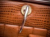 a close up of a purse with a handle on it