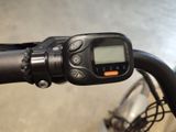 a close up of a bicycle handlebar with a digital display