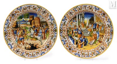 two plates with a painting of a biblical scene on them
