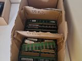many different types of ram modules in boxes on a table