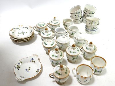 a lot of small dishes and cups on the table
