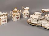 a lot of different pieces of porcelain on the table