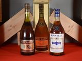 three bottles of wine sitting next to each other on a table