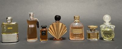 several different types of perfume bottles lined up on a table
