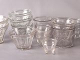 a lot of glasses that are sitting on a table
