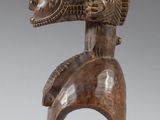 an image of a wooden sculpture of a horse head