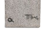 a picture of a cement block with the word tiff written on it