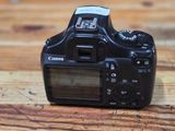 a small camera sitting on a wooden table