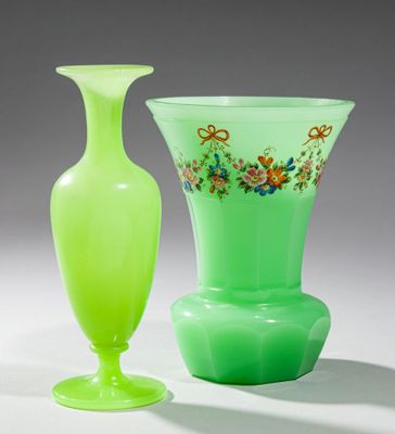 two vases sitting next to each other on a table