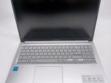 an open laptop computer sitting on top of a white table