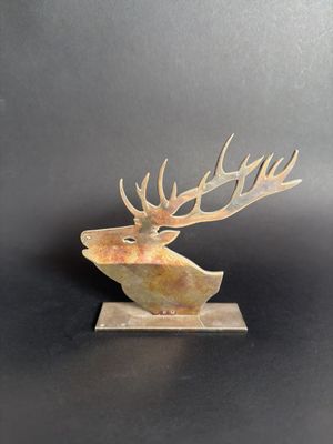 a close up of a sculpture of a deer with antlers on it