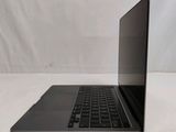an open laptop computer sitting on top of a white surface