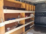 a small storage area in the back of a van